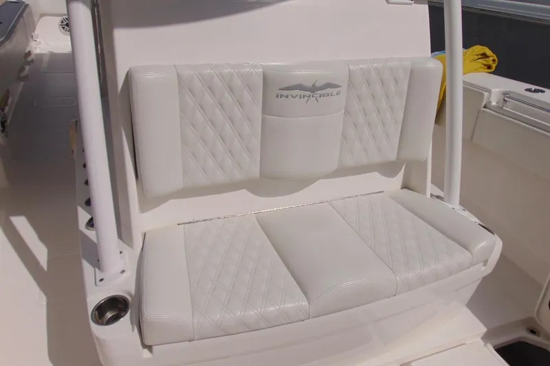 Slide: The Image of White leather seating on 2020 Invincible 36 Open boat, featuring diamond stitching. - 14