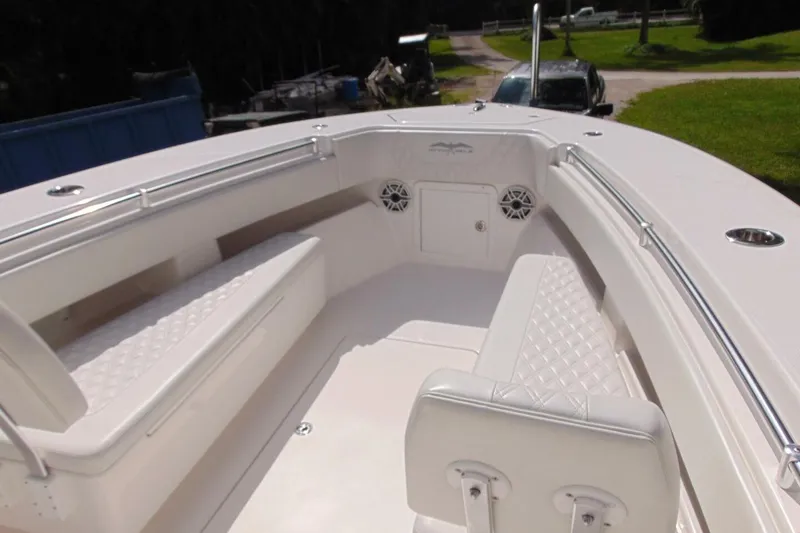 Slide: The Image of 2020 Invincible 36 Open boat interior with white seating and stainless steel railings. - 16