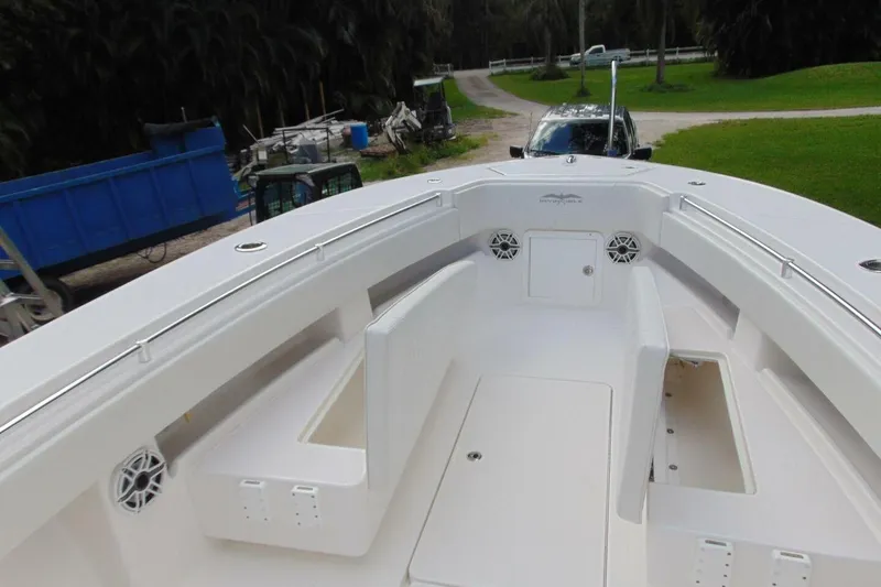 Slide: The Image of 2020 Invincible 36 Open boat interior with seating and storage compartments. - 17