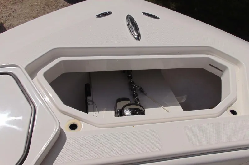 Slide: The Image of Anchor storage compartment on 2020 Invincible 36 Open boat, featuring a chain and cleat. - 18