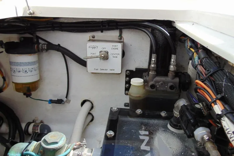 Slide: The Image of Engine compartment of 2020 Invincible 36 Open boat with fuel selector valve and wiring. - 21