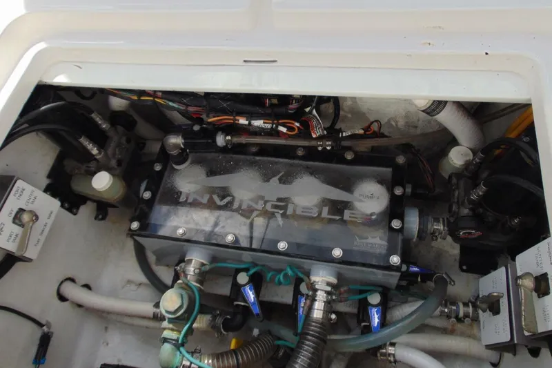 Slide: The Image of Engine compartment of 2020 Invincible 36 Open boat, showcasing mechanical components and wiring. - 22
