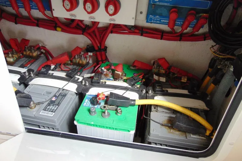 Slide: The Image of Battery compartment of 2020 Invincible 36 Open boat with wiring and connections. - 23