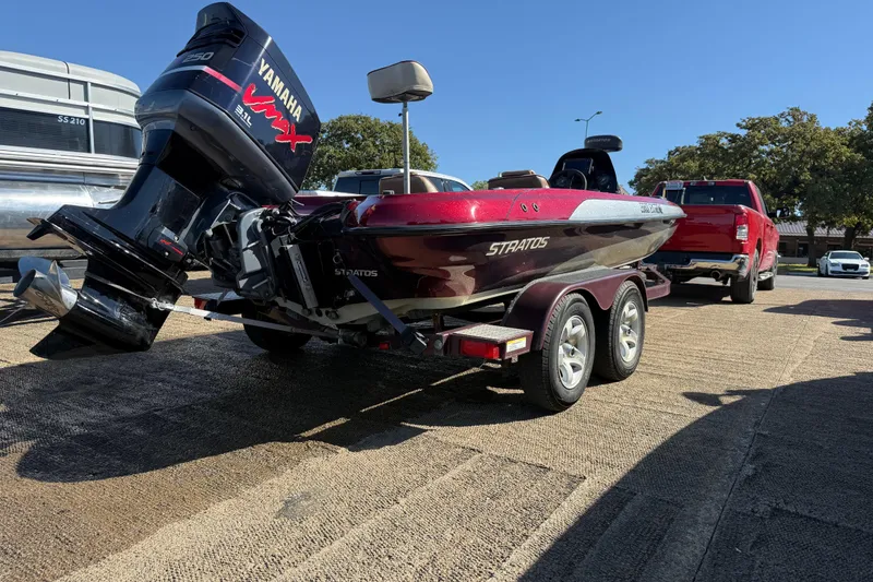 Slide: The Image of 2000 Stratos 20SS Extreme boat on trailer with Yamaha VMAX engine, parked near water. - 13