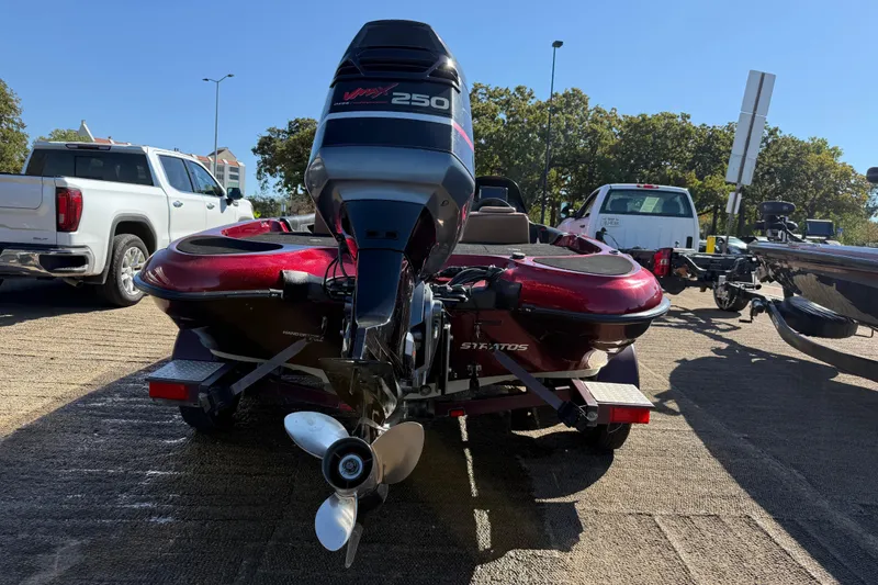 Slide: The Image of Minn Kota Fortrex trolling motor on 2000 Stratos 20SS Extreme boat by the lake. - 15