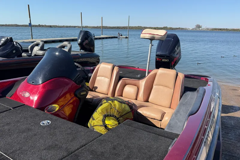 Slide: The Image of 2000 Stratos 20SS Extreme boat on trailer by lakeside, clear sky, parked vehicles nearby. - 26