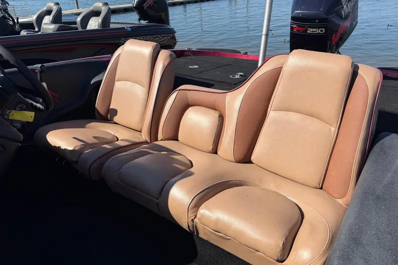 Slide: The Image of 2000 Stratos 20SS Extreme boat trailer by a lake, showcasing dual wheels and branding. - 27