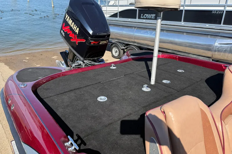 Slide: The Image of Open storage compartments on a 2000 Stratos 20SS Extreme boat deck. - 31