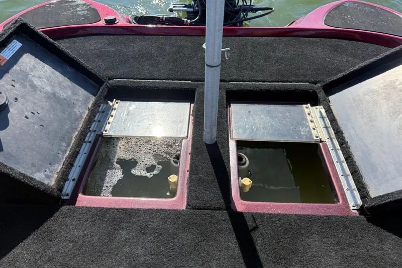 Slide: The Image of 2000 Stratos 20SS Extreme boat interior with steering wheel and navigation system on water. - 38