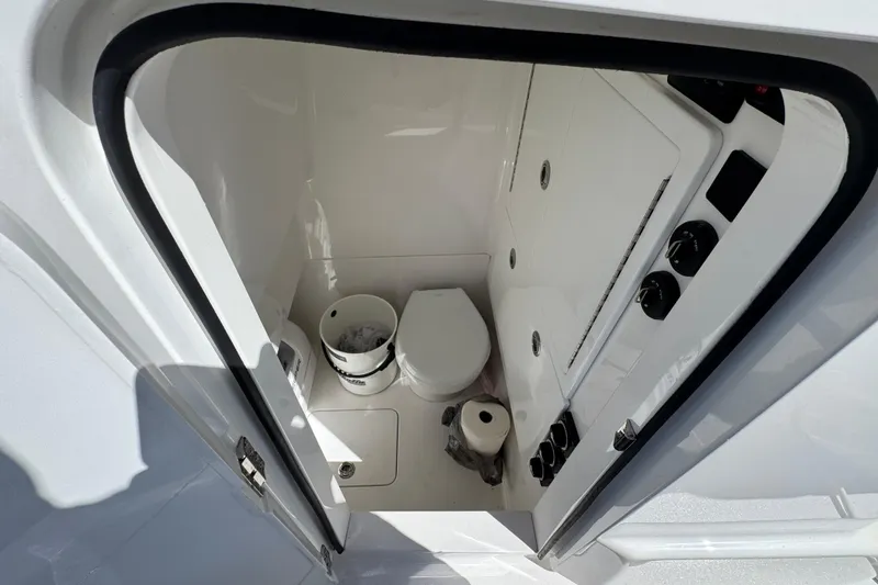 Slide: The Image of 2024 Valhalla V-29 Hybrid boat interior with compact bathroom amenities. - 10