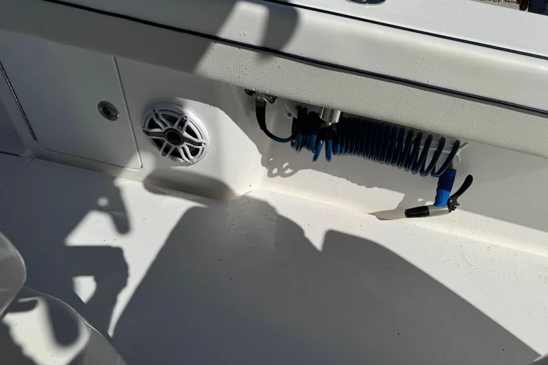 Slide: The Image of 2024 Valhalla V-29 Hybrid boat interior with speaker and coiled hose. - 11