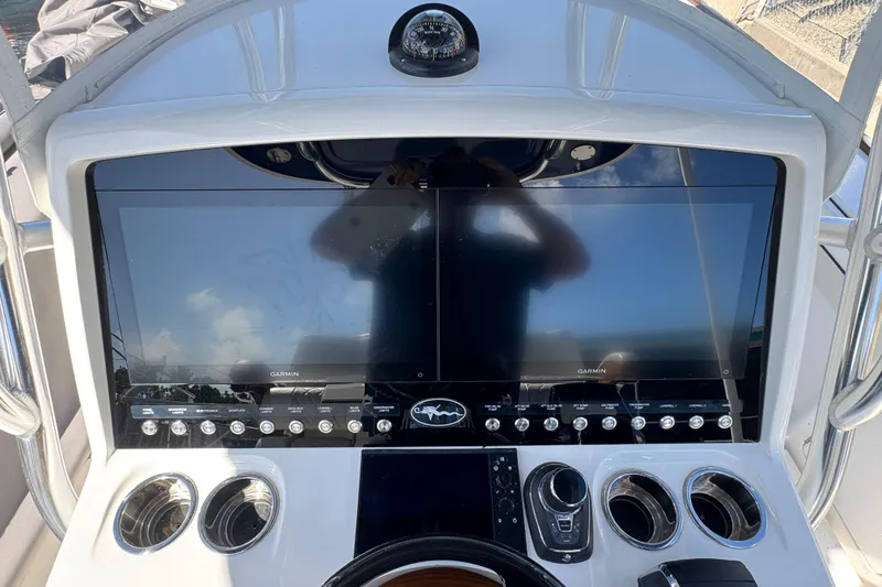 Slide: The Image of 2024 Valhalla V-29 Hybrid boat dashboard with dual Garmin displays and control panel. - 16