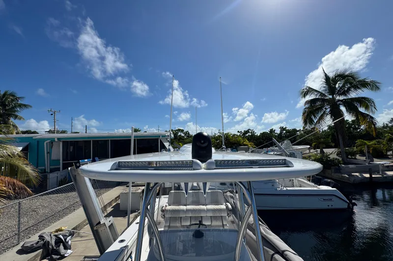 Slide: The Image of 2024 Valhalla Boatworks V-29 Hybrid docked under clear blue sky. - 23