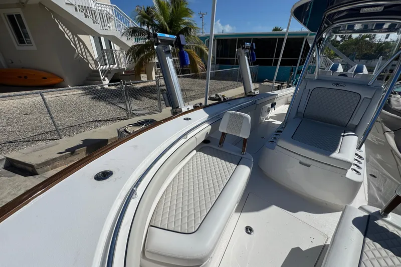 Slide: The Image of 2024 Valhalla V-29 Hybrid boat interior with cushioned seating and sleek design. - 26