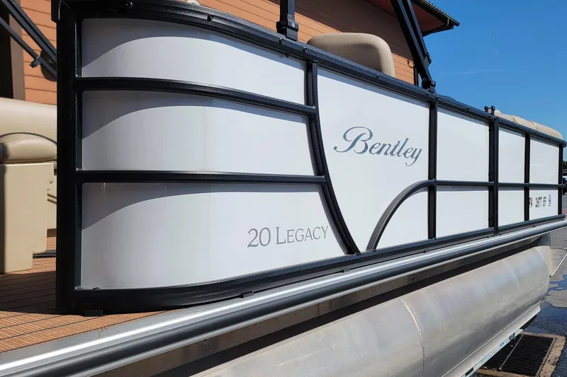 Slide: The Image of 2024 Bentley Pontoons Legacy Cruise, side view showcasing sleek design and branding. - 4
