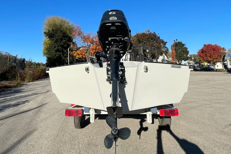 Slide: The Image of 1993 Boston Whaler Sport 11 boat on trailer, rear view, sunny day. - 5