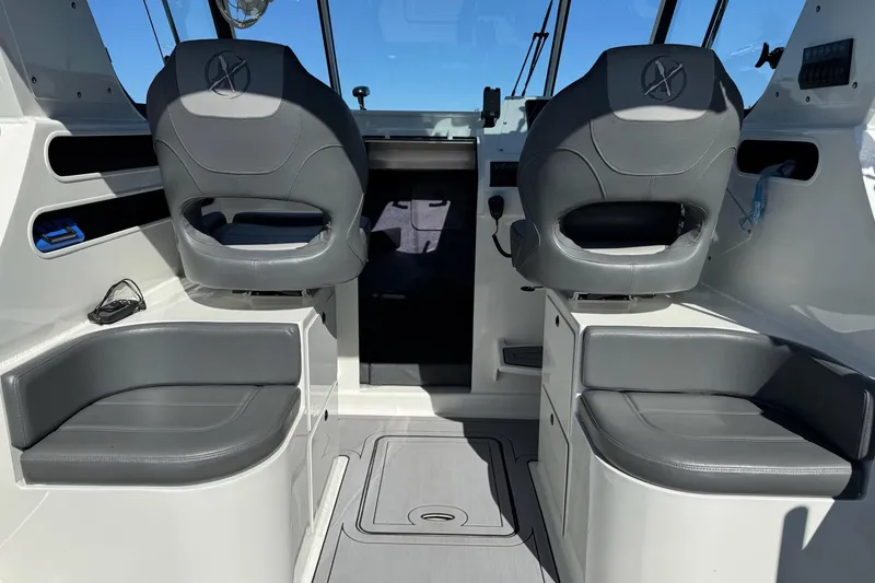 Slide: The Image of Interior of 2023 Extreme Boats 695 Game King, featuring sleek seating and modern design. - 15