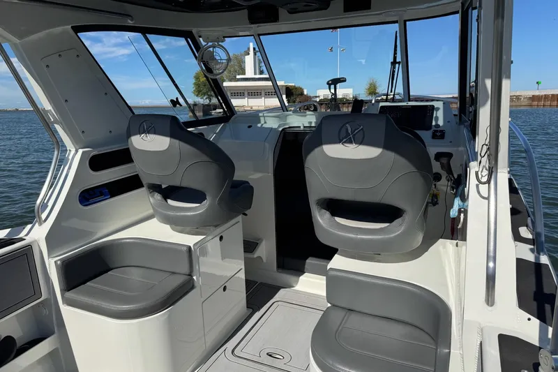 Slide: The Image of Interior of 2023 Extreme Boats 695 Game King, featuring modern seating and controls. - 23