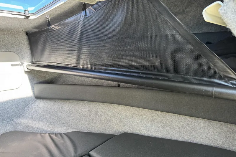 Slide: The Image of Interior view of 2023 Extreme Boats 695 Game King cabin with storage netting. - 30