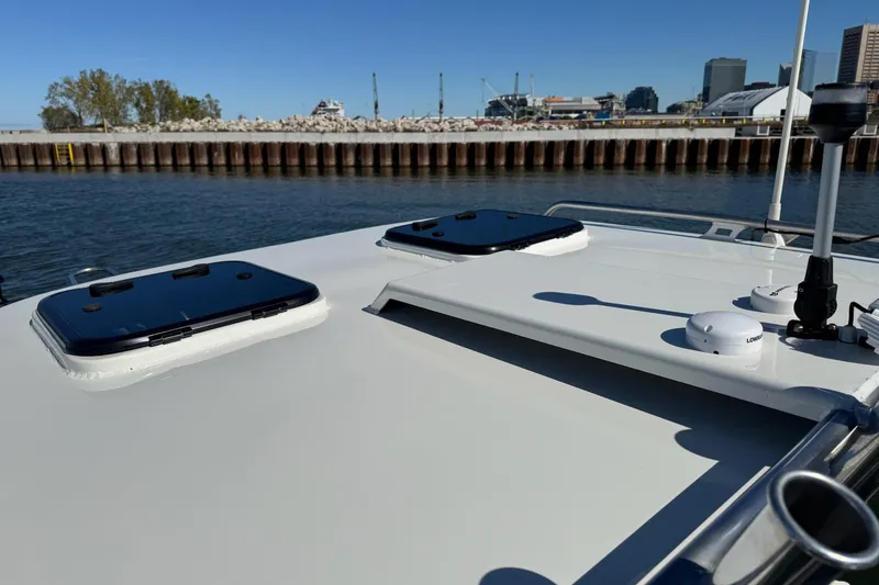Slide: The Image of 2023 Extreme Boats 695 Game King on water near urban skyline. - 6