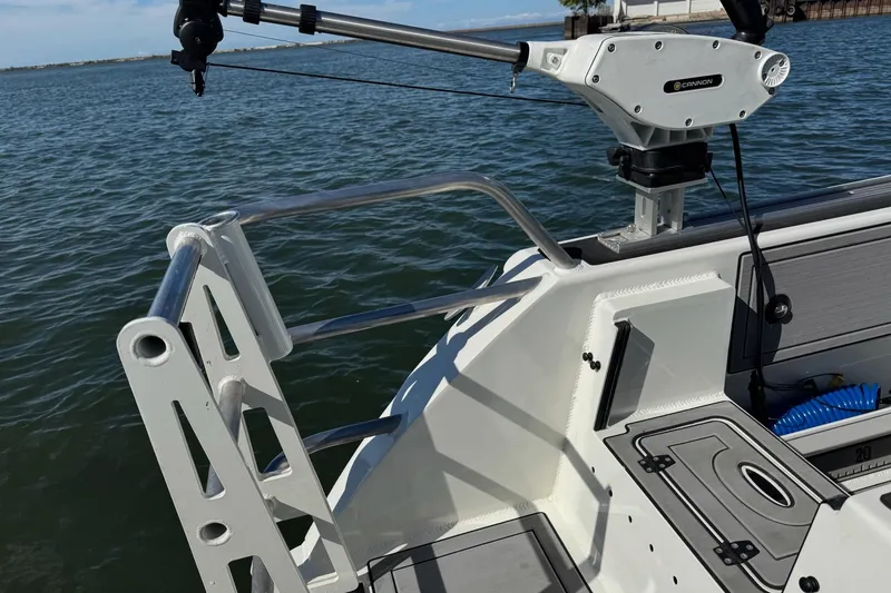 Slide: The Image of 2023 Extreme Boats 695 Game King, featuring a sturdy fishing rod holder and sleek deck design. - 7