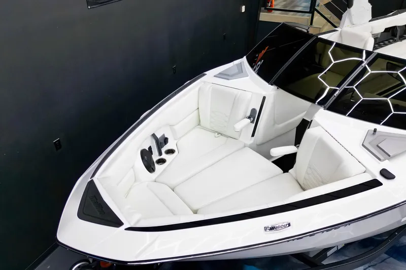 Slide: The Image of 2023 Malibu Wakesetter 26 LSV boat interior with white seating and modern design. - 11