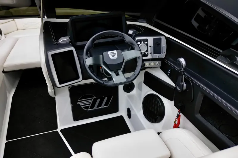 Slide: The Image of 2023 Malibu Wakesetter 26 LSV interior dashboard with modern steering and controls. - 13