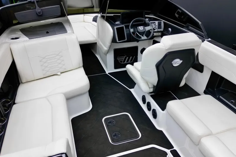 Slide: The Image of 2023 Malibu Wakesetter 26 LSV interior with luxurious white seating and modern dashboard. - 14