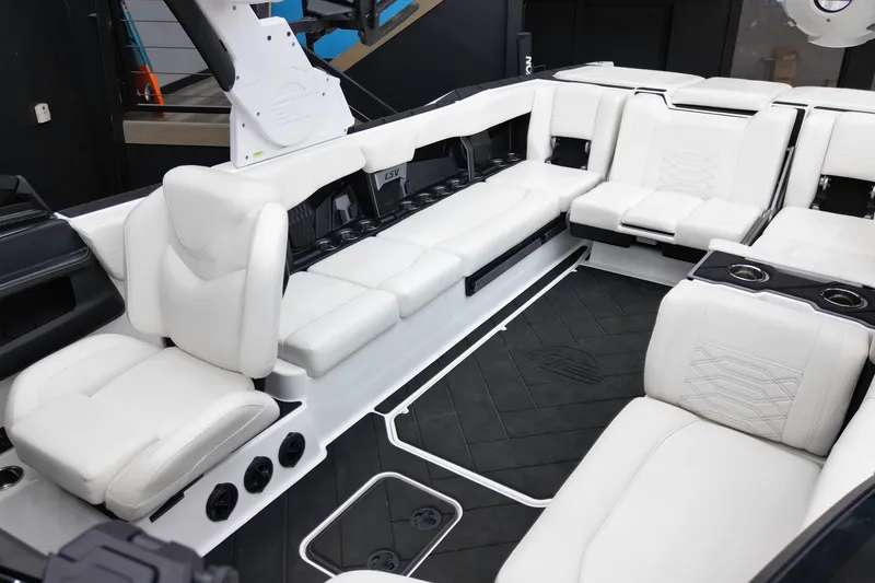 Slide: The Image of 2023 Malibu Wakesetter 26 LSV interior with luxurious white seating and modern design. - 15