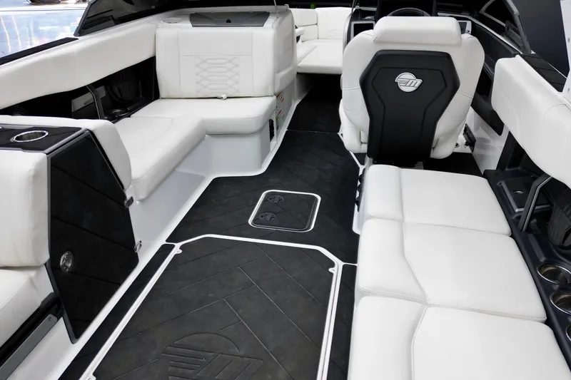 Slide: The Image of 2023 Malibu Wakesetter 26 LSV interior with luxurious white seating and sleek design. - 16