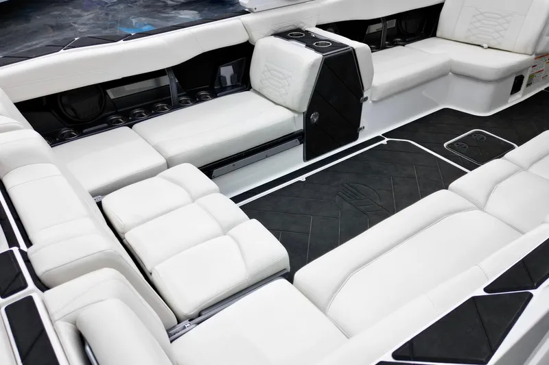 Slide: The Image of Luxurious interior of 2023 Malibu Wakesetter 26 LSV with white seating and sleek design. - 17