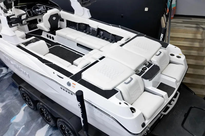 Slide: The Image of 2023 Malibu Wakesetter 26 LSV boat interior with luxurious white seating and modern design. - 18
