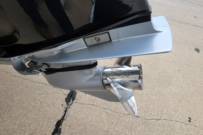 Slide: The Image of Bass Tracker PRO TEAM 190 2022 boat propeller and motor detail on concrete surface. - 11