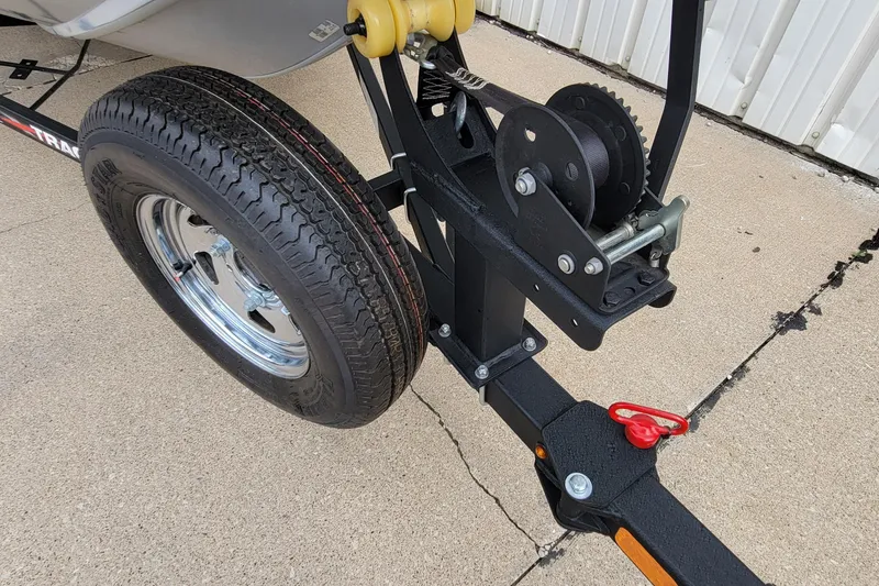 Slide: The Image of 2022 Bass Tracker PRO TEAM 190 trailer hitch and wheel on concrete surface. - 13