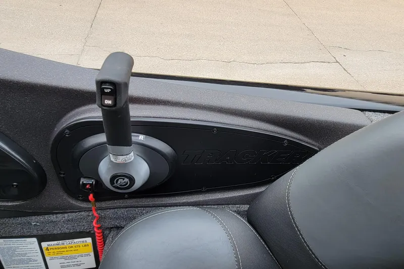 Slide: The Image of Bass Tracker PRO TEAM 190 boat control panel, 2022 model, featuring throttle and seat. - 16