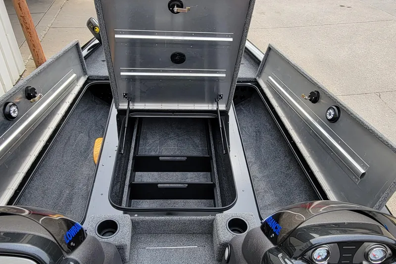 Slide: The Image of 2022 Bass Tracker PRO TEAM 190 boat interior with open storage compartments. - 18