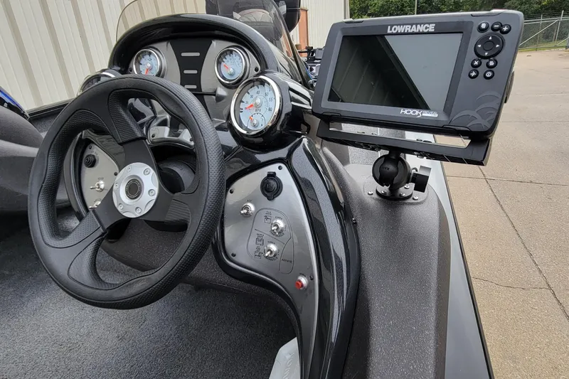 Slide: The Image of 2022 Bass Tracker PRO TEAM 190 dashboard with Lowrance fish finder and steering wheel. - 20