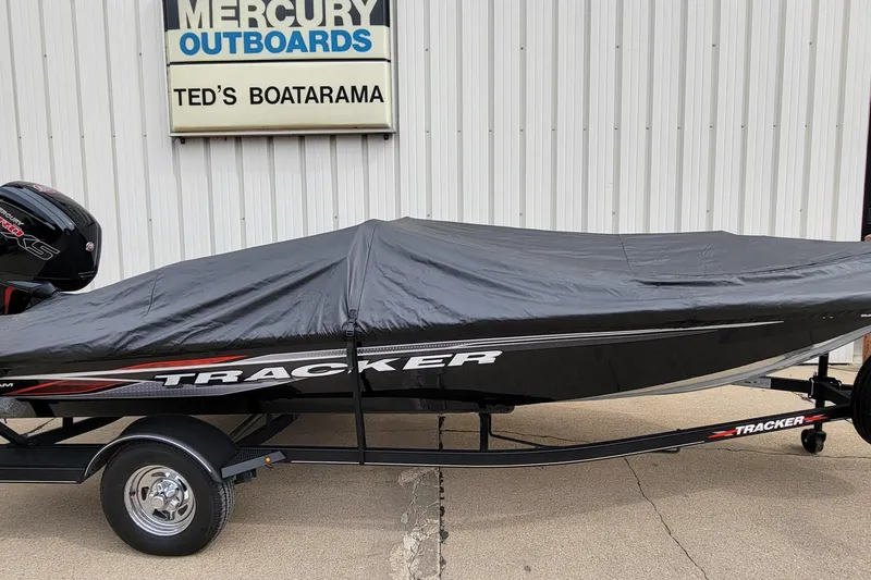 Slide: The Image of 2022 Bass Tracker PRO TEAM 190 boat covered, parked at Ted's Boatarama. - 30