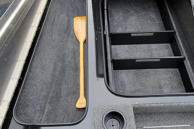 Slide: The Image of Bass Tracker PRO TEAM 190 boat interior with wooden paddle, 2022 model. - 33