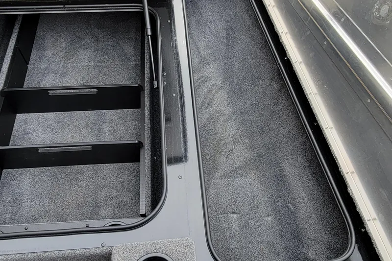 Slide: The Image of Interior view of 2022 Bass Tracker PRO TEAM 190 boat storage compartments. - 34