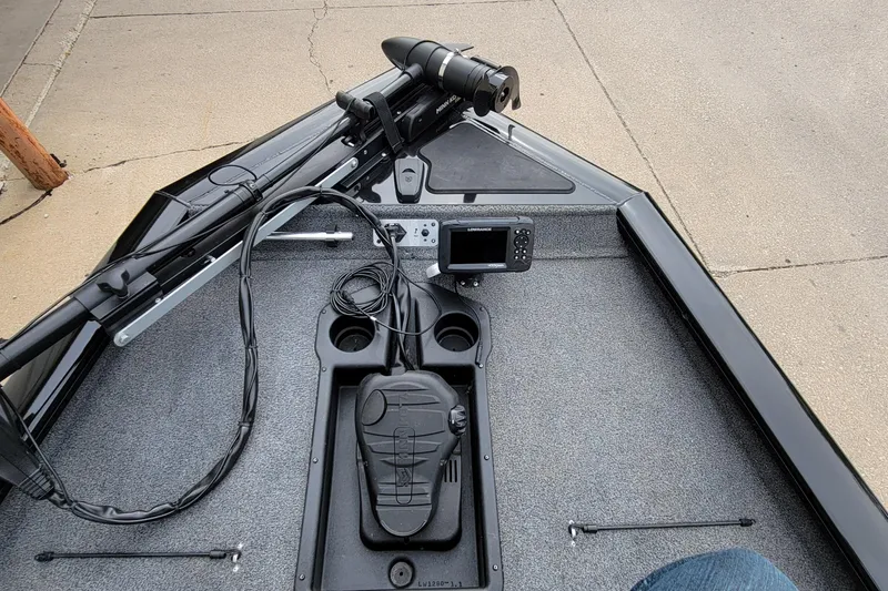 Slide: The Image of 2022 Bass Tracker PRO TEAM 190 boat deck with navigation equipment and controls. - 35