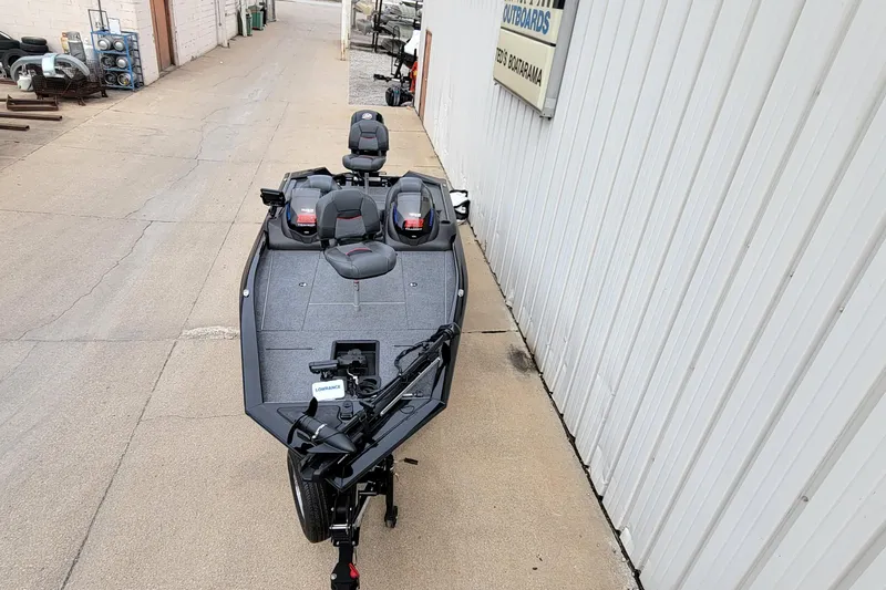 Slide: The Image of 2022 Bass Tracker PRO TEAM 190 boat parked beside a building. - 37