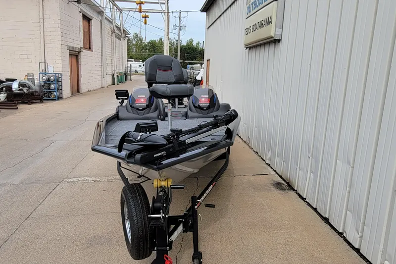 Slide: The Image of 2022 Bass Tracker PRO TEAM 190 boat parked outside a building. - 4