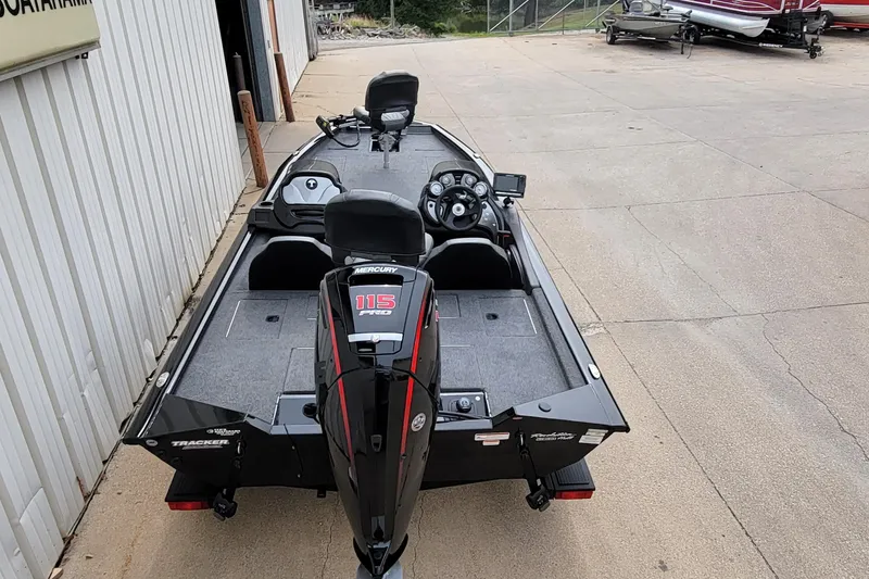 Slide: The Image of 2022 Bass Tracker PRO TEAM 190 boat with Mercury 115 Pro motor, parked outdoors. - 6