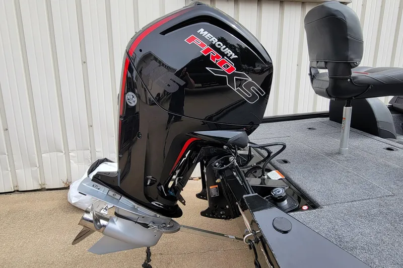 Slide: The Image of 2022 Bass Tracker PRO TEAM 190 with Mercury Pro XS outboard motor, docked on concrete. - 8