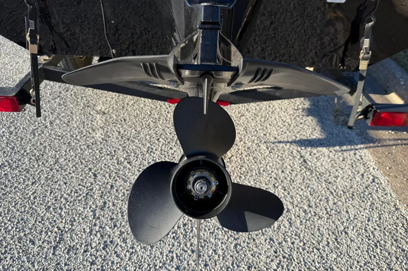 Slide: The Image of 2020 Tracker Pro Team 175 boat propeller on a trailer, close-up view. - 10