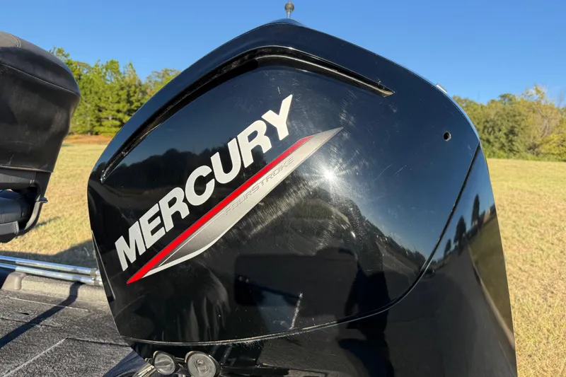Slide: The Image of Mercury outboard motor on 2020 Tracker Pro Team 175 boat, outdoors in sunny setting. - 12