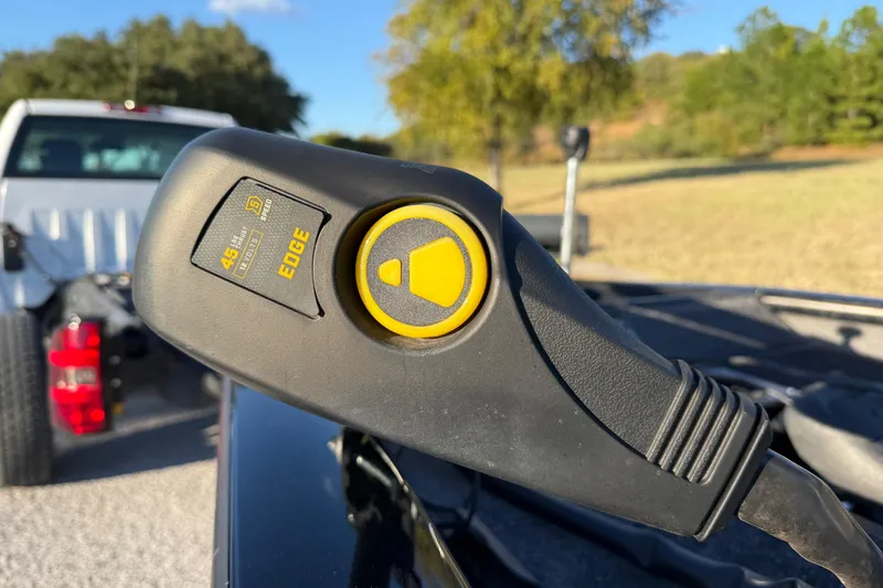 Slide: The Image of Close-up of a 2020 Tracker Pro Team 175 boat control handle outdoors. - 19