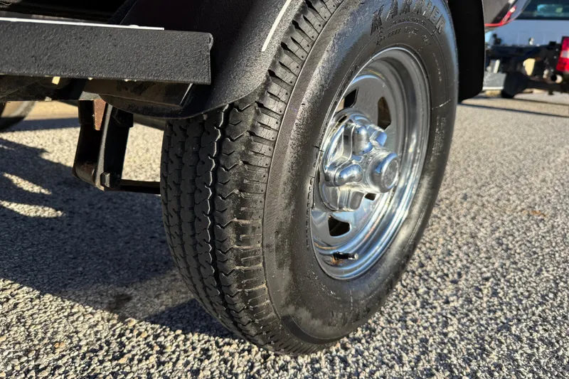 Slide: The Image of Close-up of a 2020 Tracker Pro Team 175 trailer tire on asphalt. - 23