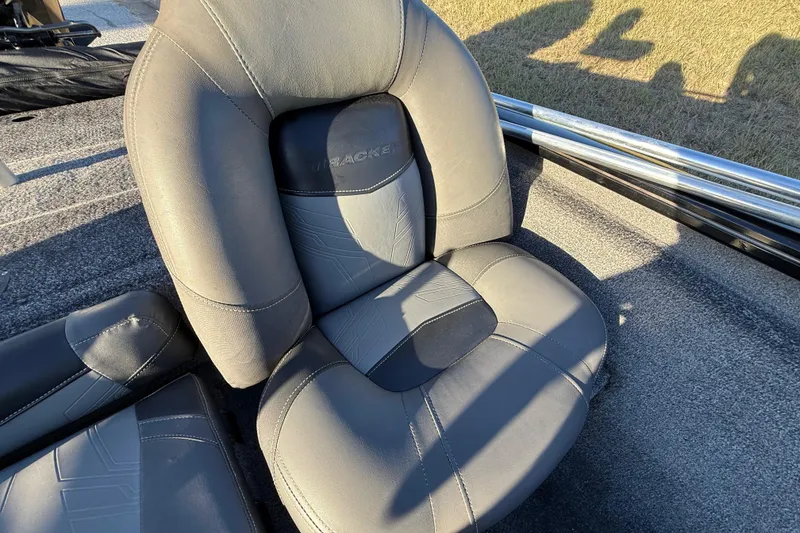 Slide: The Image of 2020 Tracker Pro Team 175 boat seat, gray upholstery, sunlight casting shadows. - 34